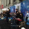Live band performing on New York City street on stage in front of NYC event