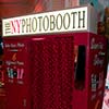 Red NY Photobooth used as Novelty Entertainment for guests at upscale NYC event